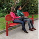 Anwendungsbeispiel: Sitzbank mit Rückenlehne im Park in der Farbe Verkehrsrot RAL 3020